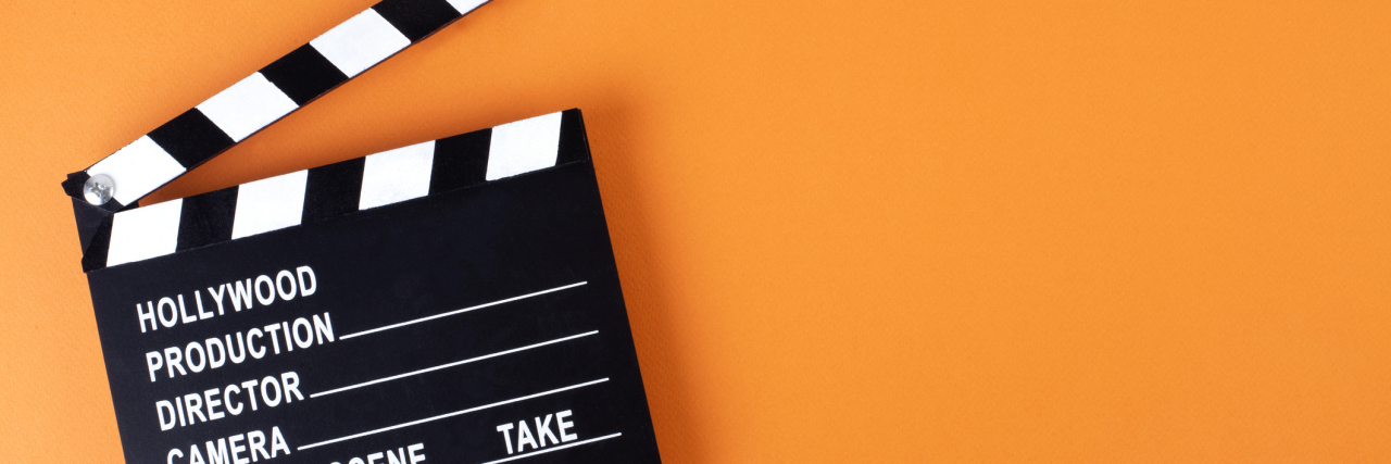 New Oscars Diversity Rules May Increase Disability Representation Movie clapper board on orange background