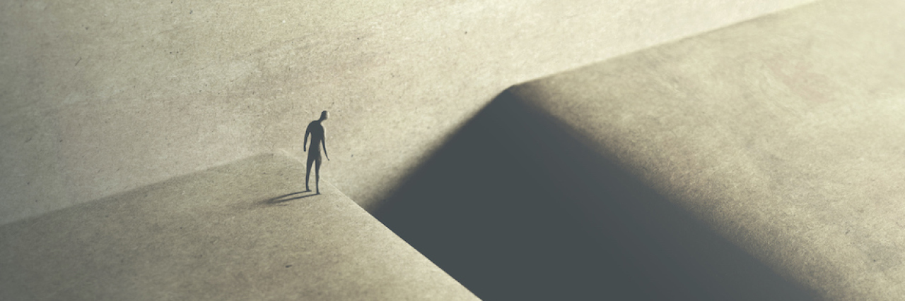 How Dissociated 'Parts' Are Not the Same as 'Alters' illustration man at the edge of the ravine