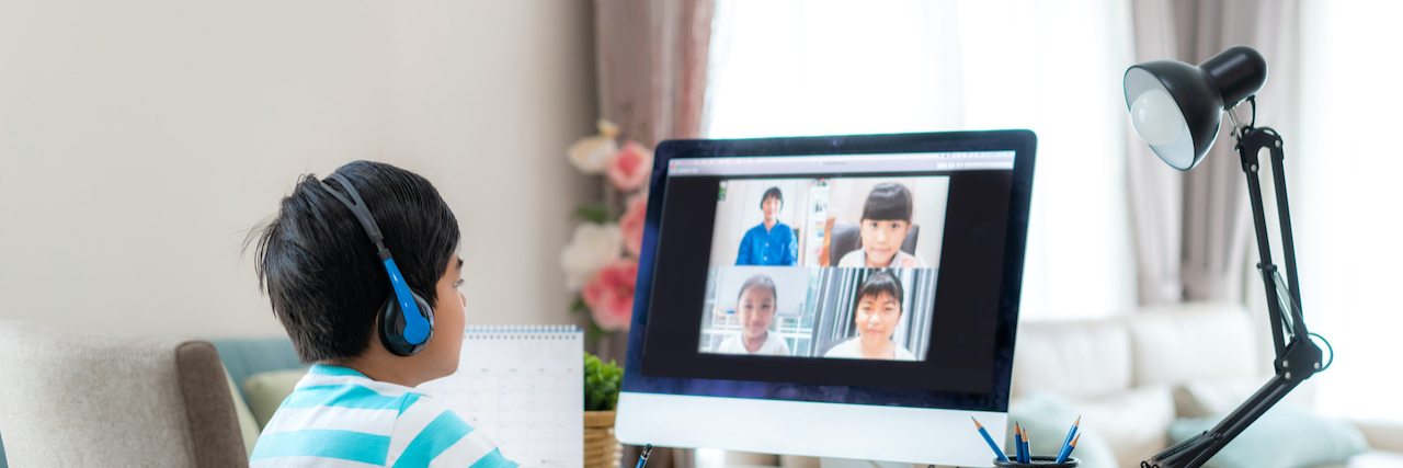 Supporting Children's Social-Emotional Learning During COVID-19 Asian student looking at diverse classmate on computer screen