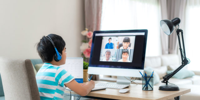 4 Strategies to Help Meet Your Child's Social-Emotional Needs at Home Asian student looking at diverse classmate on computer screen