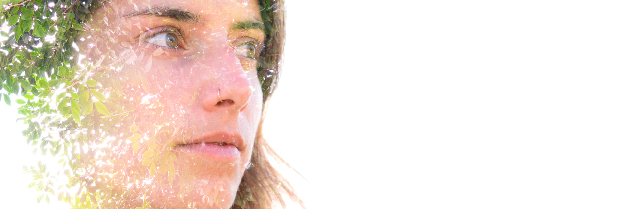 Accepting My Body as a Disabled Person in Eating Disorder Recovery Double exposure portrait of a young woman with leaves.