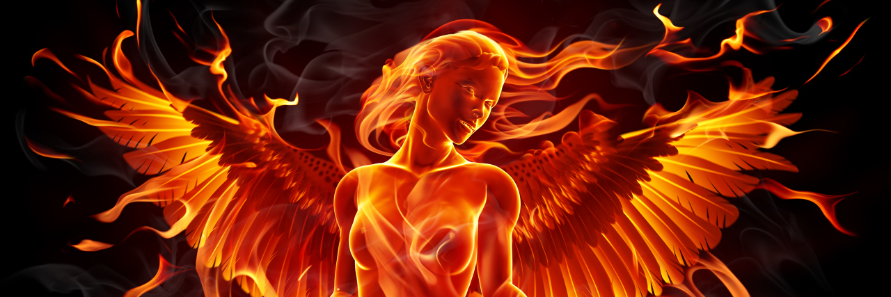 Woman phoenix rising from the ashes.