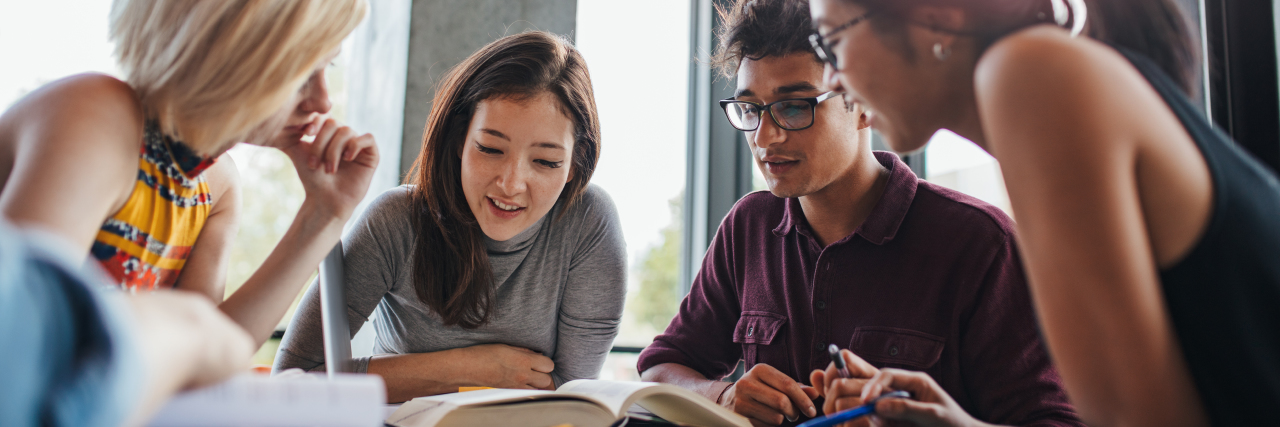 Why College Students With Disabilities Need Priority Registration University students in library.