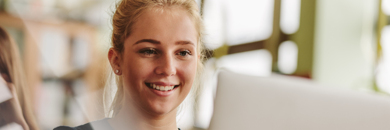 Finding the Silver Lining of COVID-19 as Someone With a Disability University student studying with laptop.