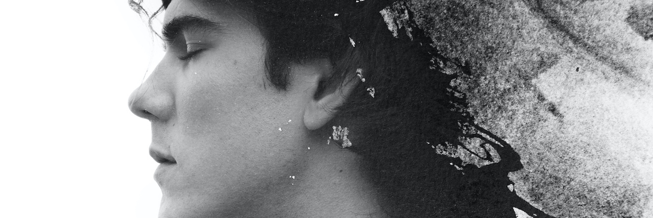How My Alters Help Me Heal From Sexual Trauma a black and white portrait of a man, the back of his head and body are blurred