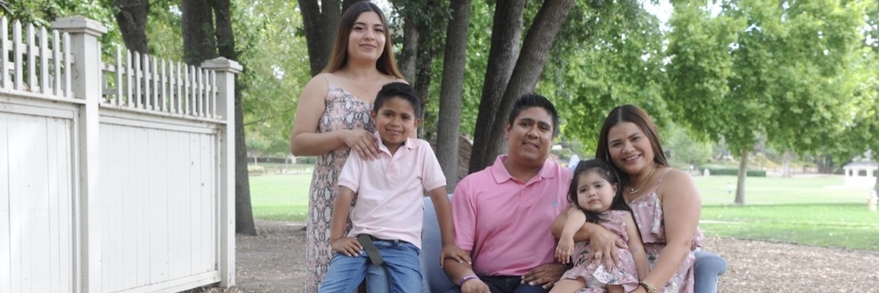 Children Miss Out on Developmental Services Due to Complex System Karla Garcia, right, with her daughter Brianna and the rest of her family: husband Rigoberto Cordova, oldest daughter Karla Patricia Cordova and son Justin Cordova. (Photo by Moment by Moment Photography).