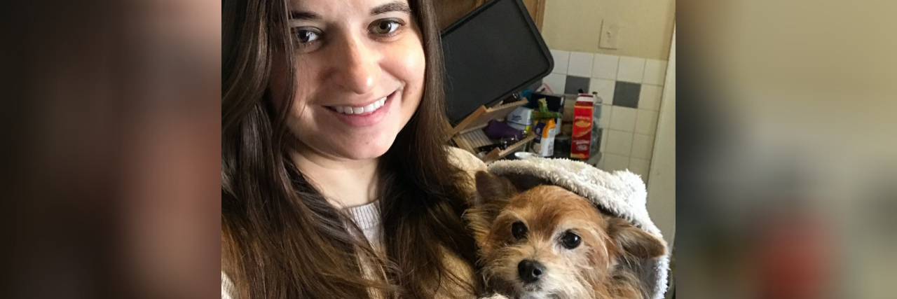 Chronic Pain Makes You a 'Difficult Person' The author holding her dog
