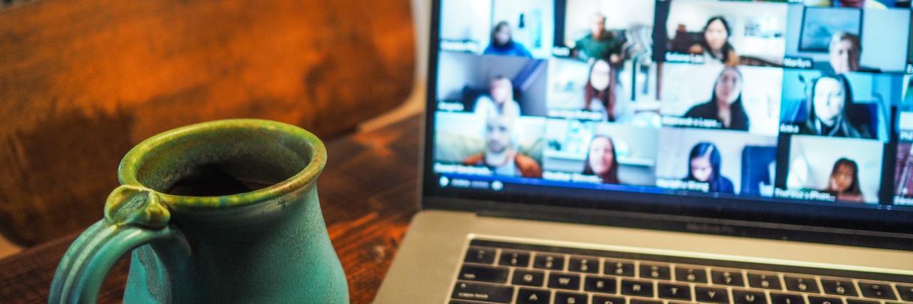 My Boss Doesn't See These Mental Health Struggles on Zoom photo of coffee mug beside laptop with an active zoom call