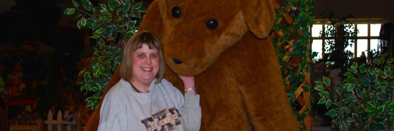Making Choices to Manage My Health in Life With Crohn's Disease Maggie with a giant plush bear.