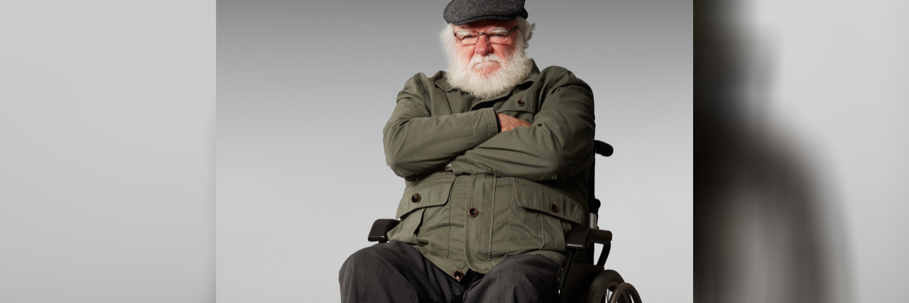 Grumpy older man who uses a wheelchair.