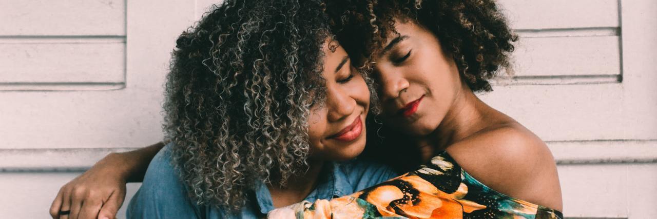 8 Reasons Trauma Survivors Self Isolate Two women embracing one another
