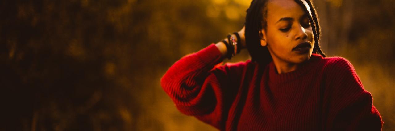 14 Subtle Ways People With Depression Reach Out for Help A woman on a golden field