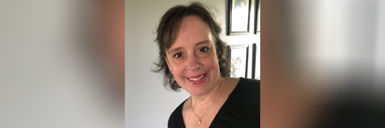 The Importance of Taking a Respite Break as a Caregiver and Parent Photo of contributor wearing a black top and smiling at the camera