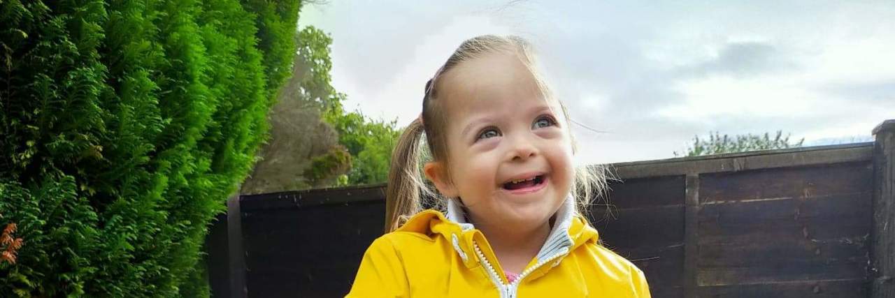 Sisters of Arden Promotes Prejudice Against People With Down Syndrome Rachel's daughter playing outside.