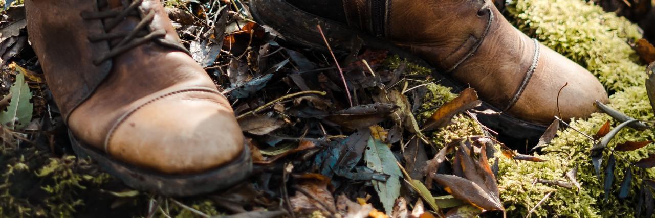 Mental Health: Figuring Out What You Need to Heal Brown boots standing amongst fall foliage and leaves