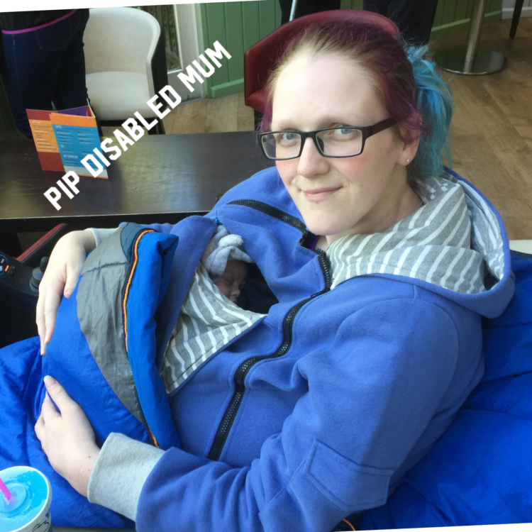 Pip holding her infant son.