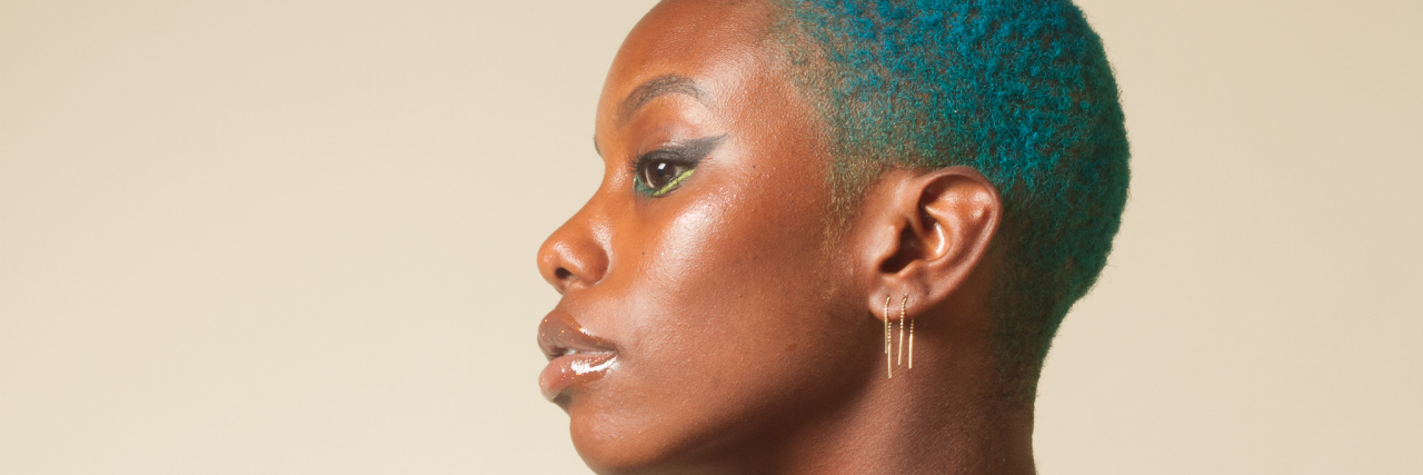 How Colorism Can Impact Self-Esteem and Self-Worth a side profile of the author, looking to the left, with blue hair