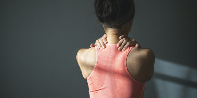 What Complex Regional Pain Syndrome Takes Away From You A woman holding her shoulders as if in pain