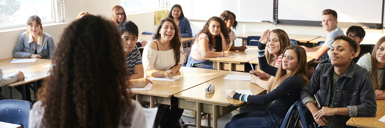 Teaching Students That It's OK to Fail Black teacher standing in front of class of diverse high school students