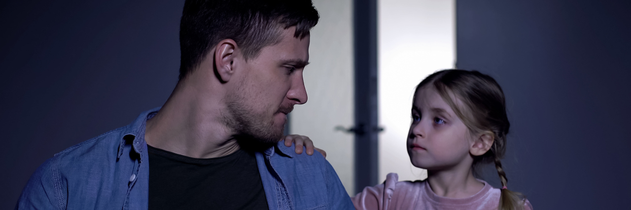 The Pain of Grief When You're Autistic Daughter comforting father.