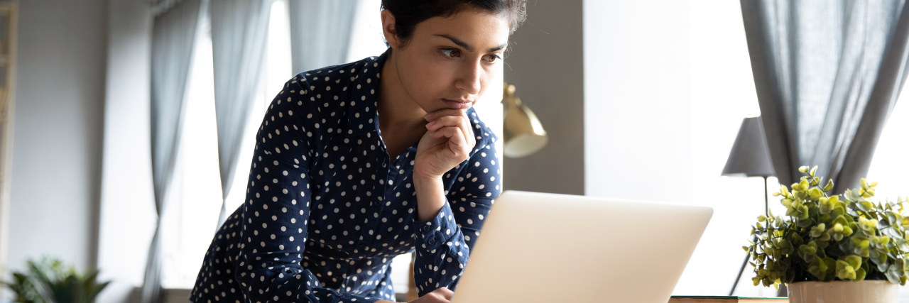 Tips for Chronic Illness Warriors in the Startup Industry Young woman working on computer from home.