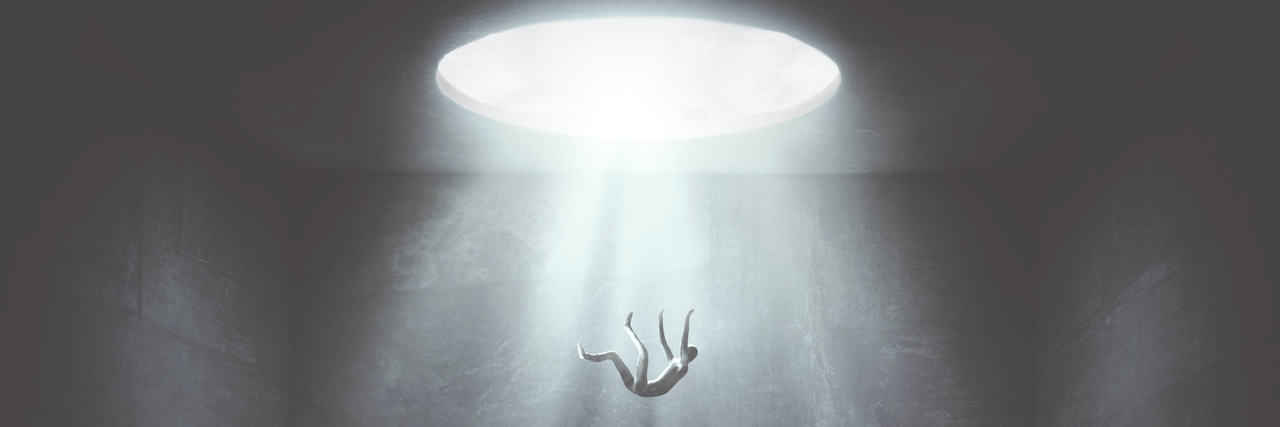 What the Depression Side of Bipolar Feels Like man falling in the void from big hole surreal concept