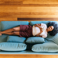 woman sitting on couch relaxing