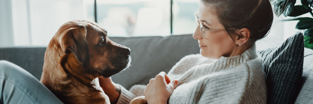 Finding a New Path as a Veterinarian With POTS Woman on the sofa with her dog.