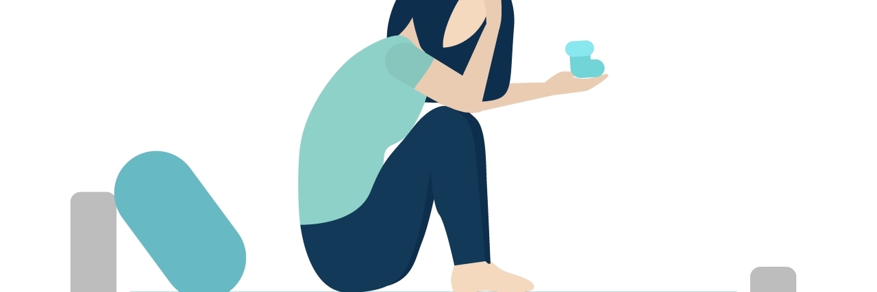 Hearing About a New Pregnancy When You're Chronically Ill white woman is sitting on hospital bed and crying.