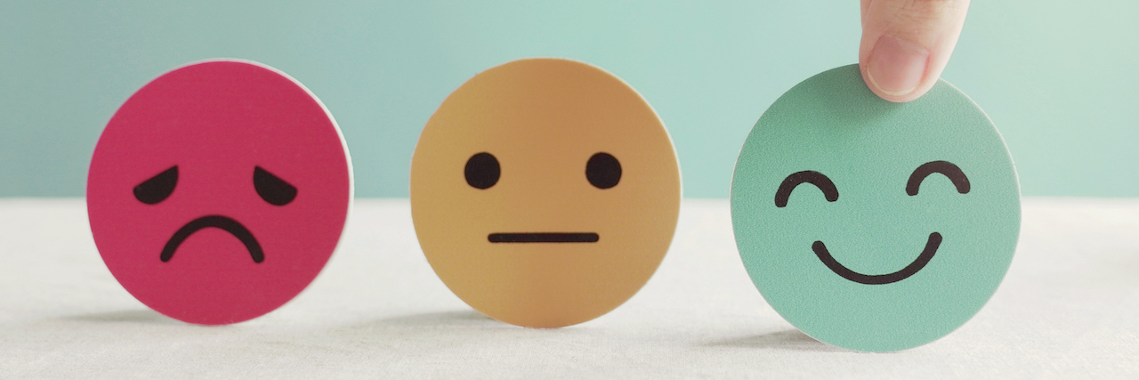 Funny Guide to See If You're a Bad Person: Mental Health Edition Hand choosing green happy smiley face paper , next to yellow neutral face and red sad face
