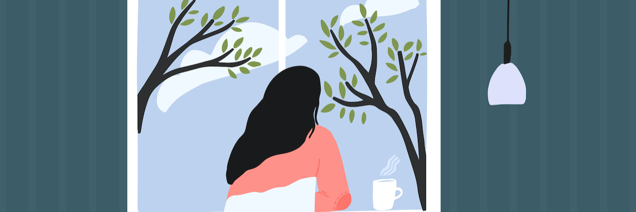 Living Through a Pandemic When You Are Immunocompromised Woman at home looking out window