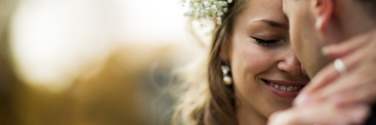 Yes, It's OK To Be Depressed After Your Wedding close up photo of a bride and groom happy on their wedding day