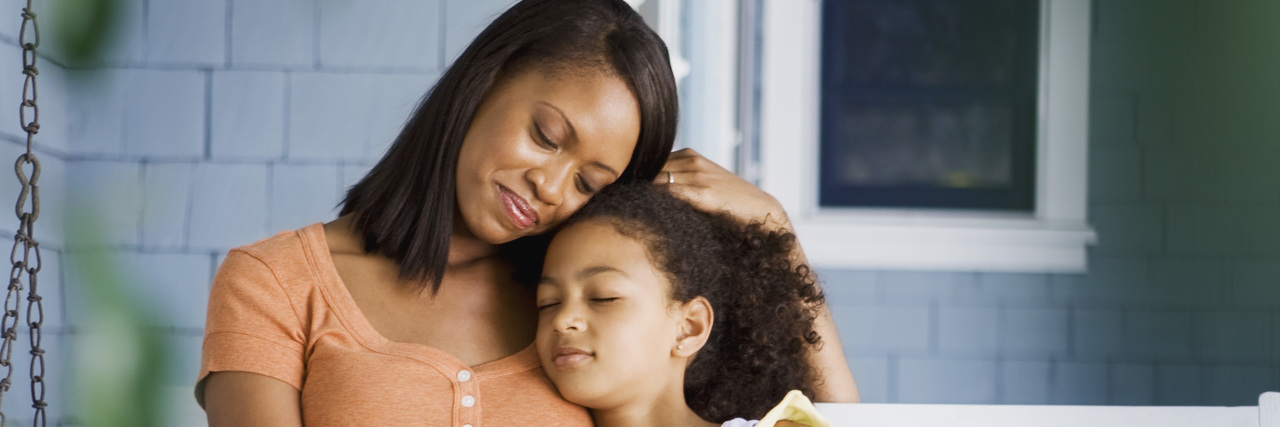 Parenting With Chronic Illness and Trying to 'Do It All' Tired mother and daughter sitting on front porch.
