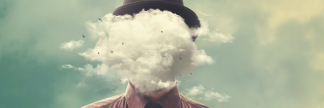 A man with a cloud over his head wearing a bowler hat
