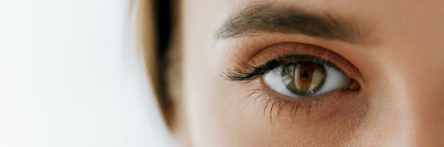 close up of a woman's eyes, which are brown