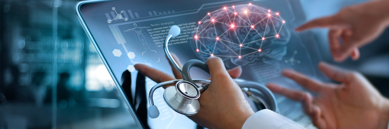 What Is Functional Neurological Disorder? Medicine doctor team meeting over a computer screen to look at how a brain is lighting up