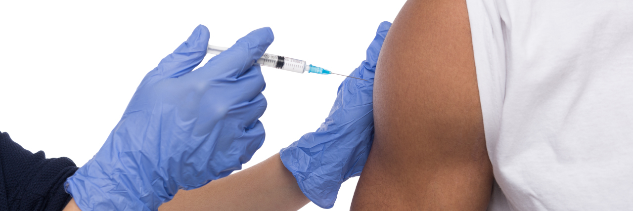 The Tuskegee Experiment, Black Americans and COVID-19 Vaccine Trials White doctor vaccinating a Black man.