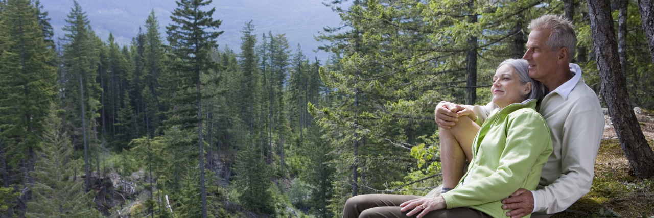 Developing a Strong Marriage While Living With a Chronic Illness Couple hiking in the mountains.