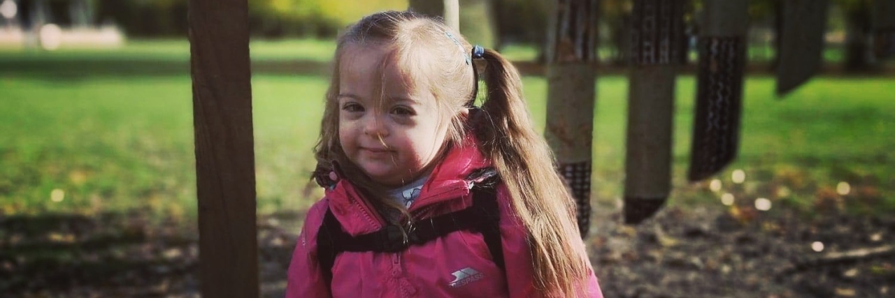 Cards Against Humanity Mocks People With Down Syndrome Toddler with Down syndrome.