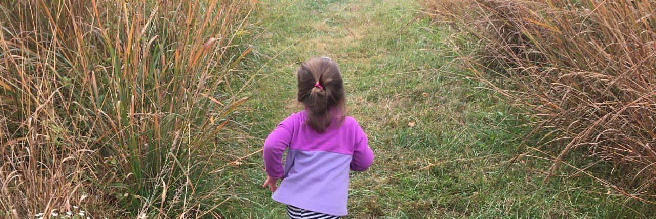 Finding My Voice to Advocate for My Daughter With Down Syndrome Hazel running in a field.