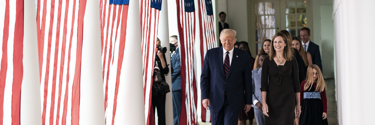 President Donald J. Trump walks with Judge Amy Coney Barrett, his nominee for Associate Justice of the Supreme Court of the United States, along the West Wing Colonnade on Saturday, September 26, 2020, following announcement ceremonies in the Rose Garden.