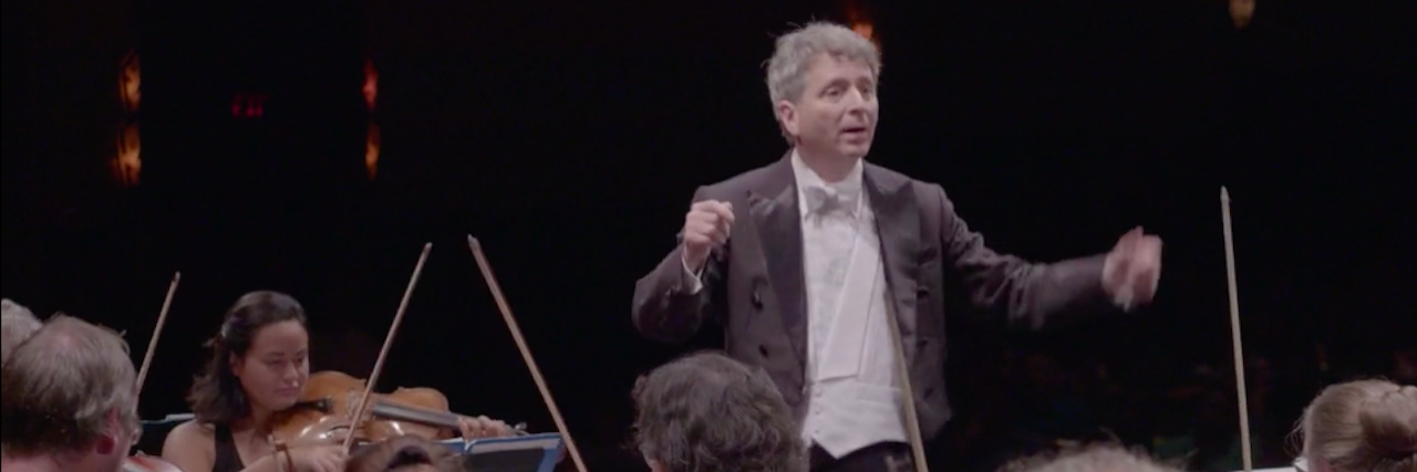 New Documentary Features Orchestra for People With Mental Illness Conductor Ronald Braunstein wears a formal tux while directing an orchestra