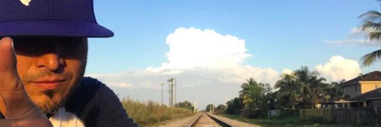 Former Menudo Band Member Anthony Galindo Ibarra Dies by Suicide at 41 Anthony Galindo Ibarra wears a ball cap and poses in front of train tracks