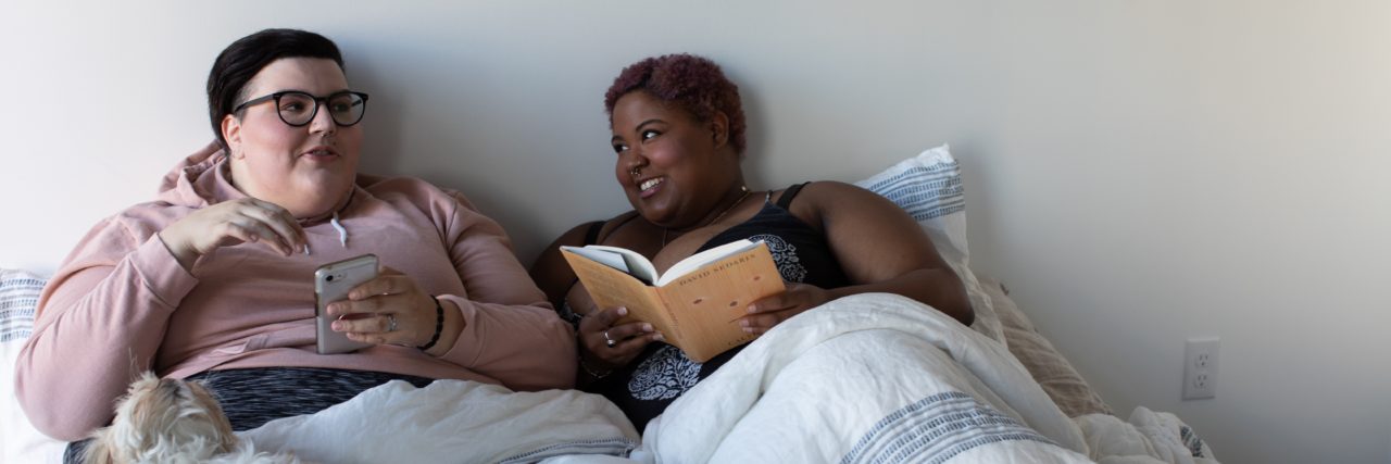 Human Beings Need Support and Connection to Survive couple laying in bed happy