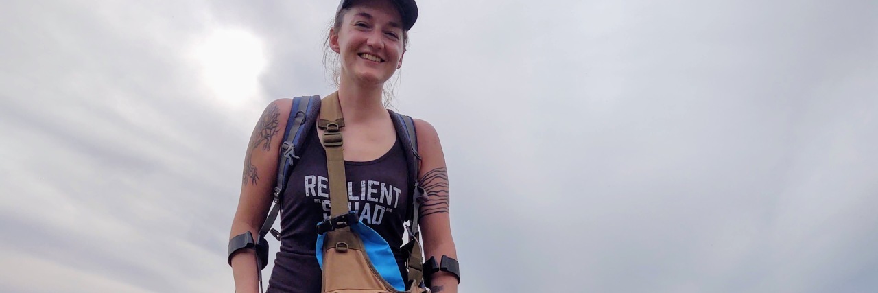 Coming to Terms With Being Disabled Amy hiking with her canes.