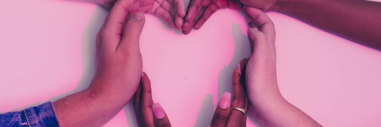 Parenting a Child With a Disability Amid COVID-19 and Social Capital different colored hands in a heart shape