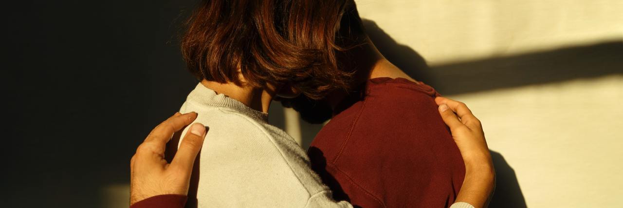 What Is Love Bombing? Two people hugging