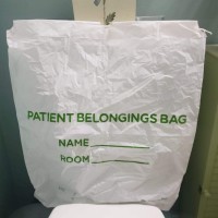 Image of a patient belongings bag on a chair at the hospital