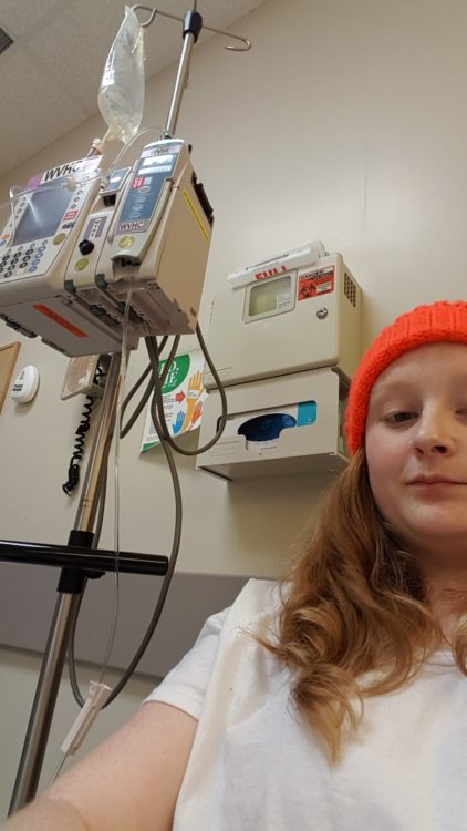 Image of contributor in a hospital setting wearing a red hat