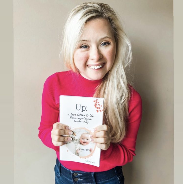 Model Grace Strobel with my book Up: A Love Letter to the Down Syndrome Community